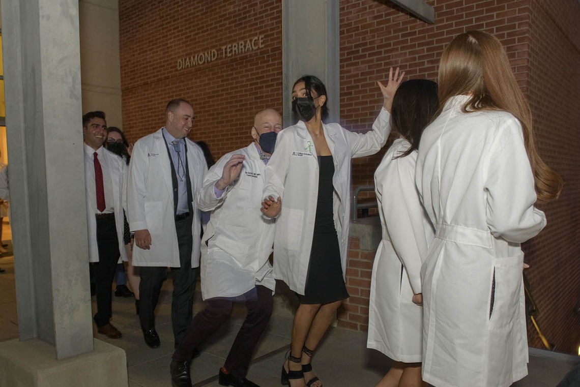 Both faculty and students couldn’t help but do a little dance after UArizona College of Medicine – Tucson class of 2024 finally had their white coat ceremony. The ceremony had been postponed twice over the past two years due to the pandemic.  