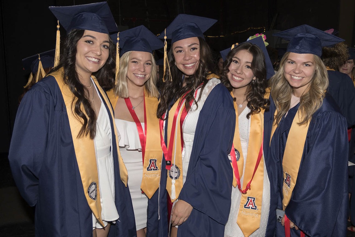 UArizona College of Nursing Bachelor of Science in Nursing students Kailey Bevan, Brooke Bottle, Morgan Auelua, Celisia Aros and Savana Wyllie wait backstage at Centennial Hall for their 2022 spring convocation to begin.
