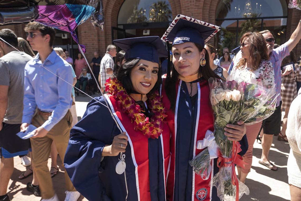 (From left) Ana Maria Walker and Misty Lafranier pose for a photo together after the UArizona College of Nursing 2022 spring convocation at Centennial Hall. 