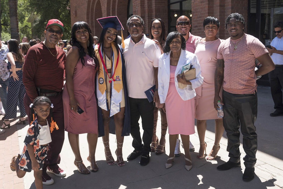 Jasmyn Countee poses for a photo with her family after being awarded a Bachelor of Science in Nursing at the UArizona College of Nursing 2022 spring convocation at Centennial Hall.
