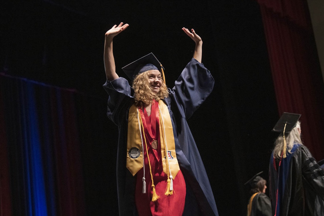 Jaquelyn Gadziala celebrates after being pinned and receiving her Bachelor of Science in Nursing during the UArizona College of Nursing 2022 spring convocation at Centennial Hall.¬