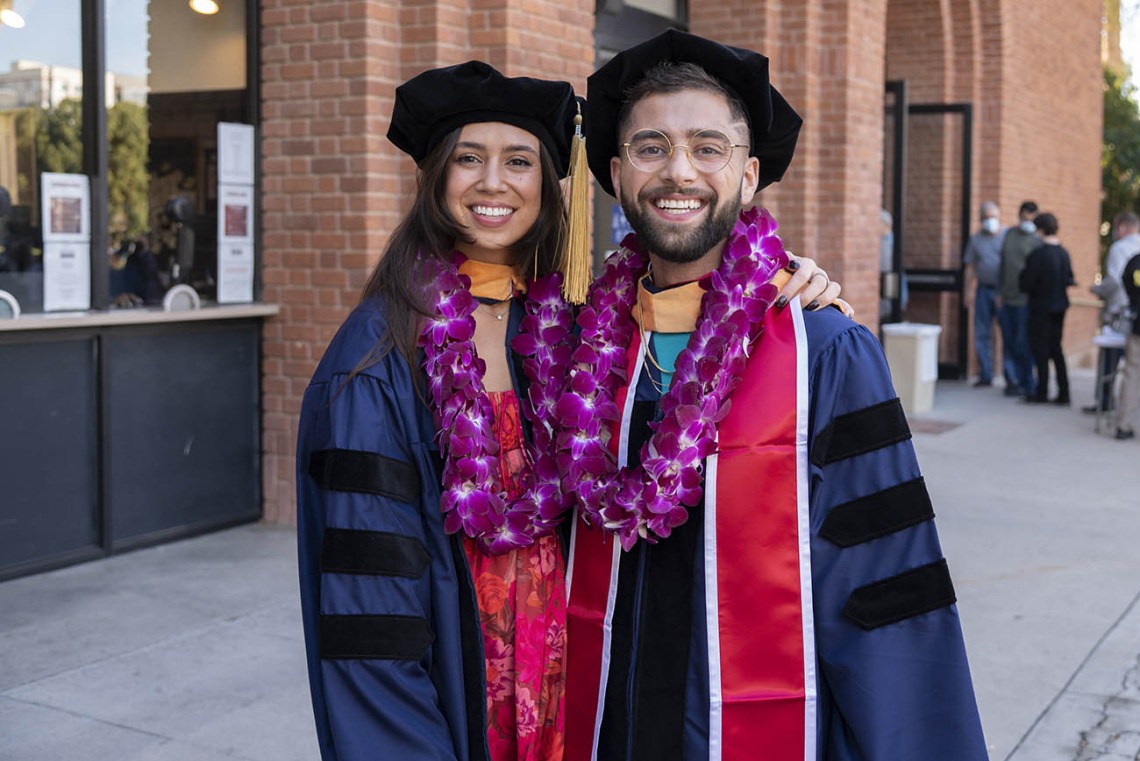 Olivia Mills poses for a photo with her best friend, Jimis Shukri, before they go into Centennial Hall for the College of Nursing fall convocation.