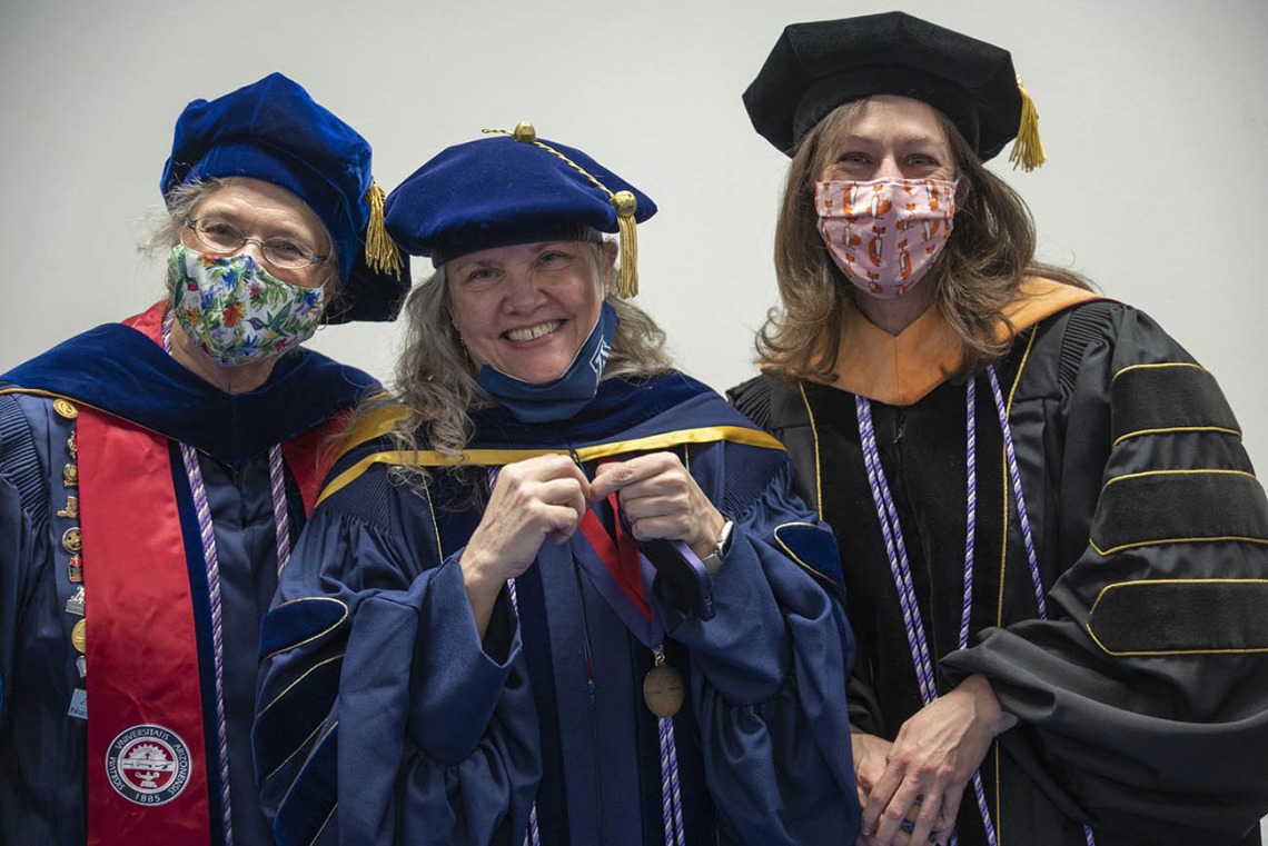 College of Nursing faculty (from left) Ruth Taylor-Piliae, Heather Carlisle and Sheri Carson wait for the fall convocation to begin at Centennial.