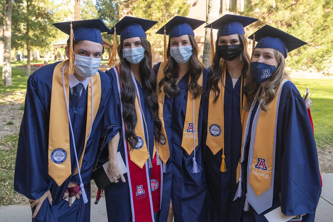 College of Nursing students (from left) Matthew Pelzek, Sophia Penuela, Sophia Piazza, Alicia Rivera and Anika Schickling pose fora photo before the start of the December convocation. 