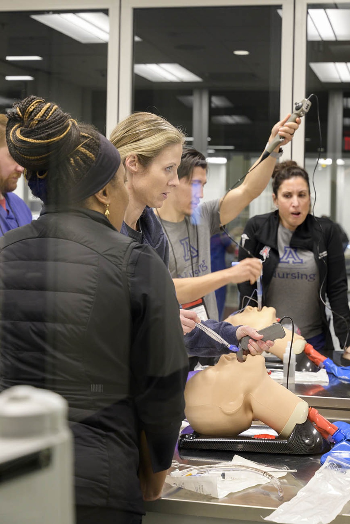 Nurse Anesthesiology Doctor of Nursing Practice students practice intubation technique during a UArizona College of Nursing clinical immersion session.