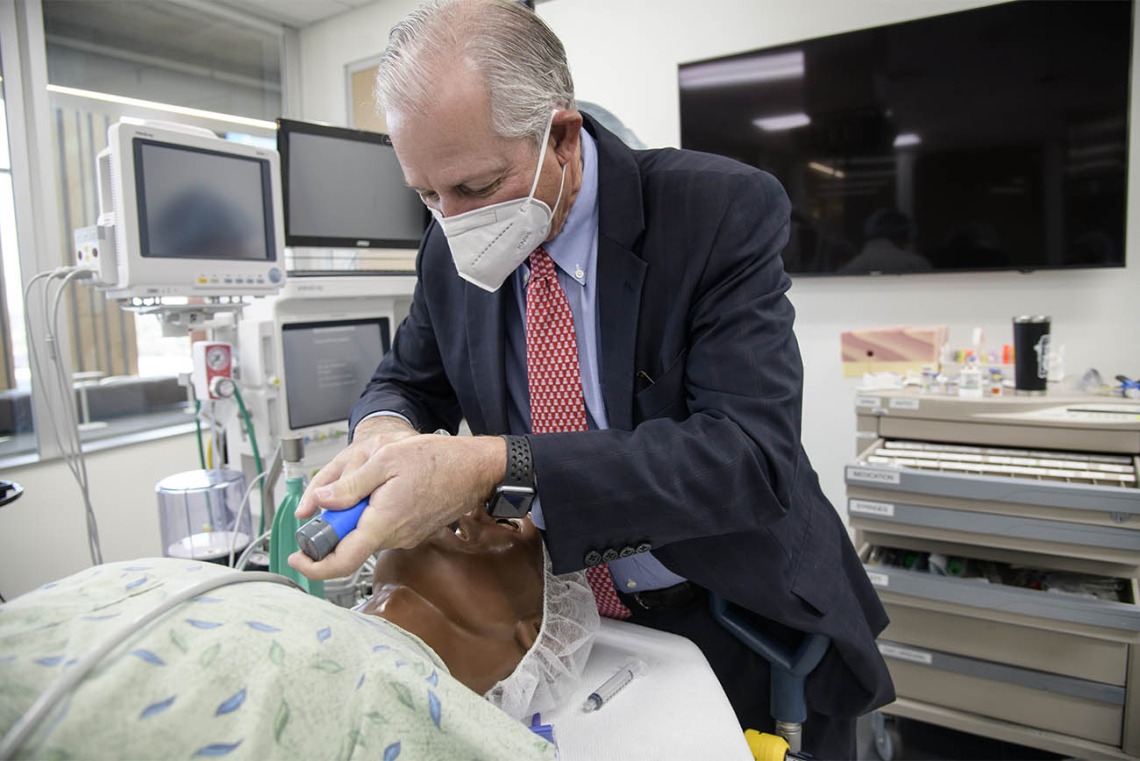 University of Arizona President Robert C. Robbins, MD, who said it had been about 35 years since he had performed an intubation, asked to give it a try after the CRNA students had finished their simulation. The procedure was successful, and the manikin survived.  