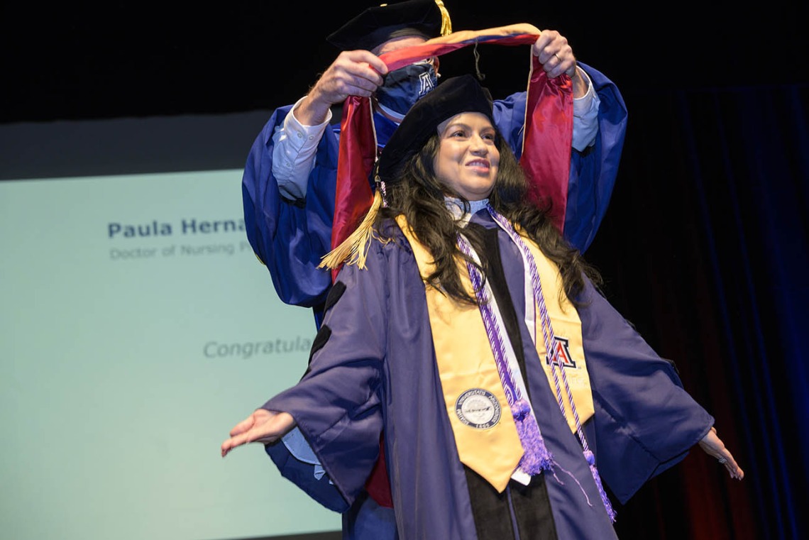 Paula Hernandez is hooded during the UArizona College of Nursing fall convocation after earning a Doctor of Nursing Practice degree. 