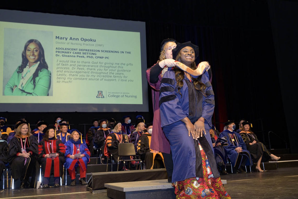 Mary Ann Opoku is hooded for earning a Doctor of Nursing Practice degree during the UArizona College of Nursing fall convocation at Centennial Hall on Dec. 15. 