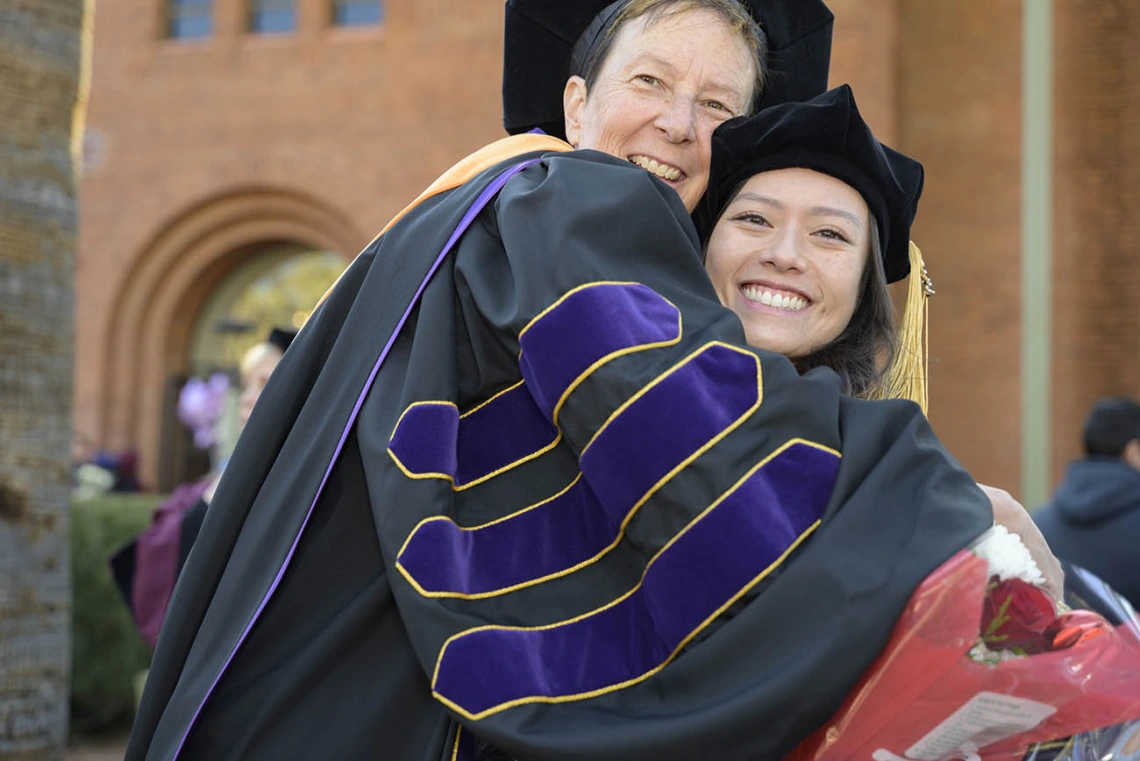 (From left) Theresa Allison, DNP, RN, FNP-C, assistant clinical professor in the College of Nursing, celebrates with Nancy Tiet, who was awarded a Doctor of Nursing Practice degree at the college’s fall convocation. 