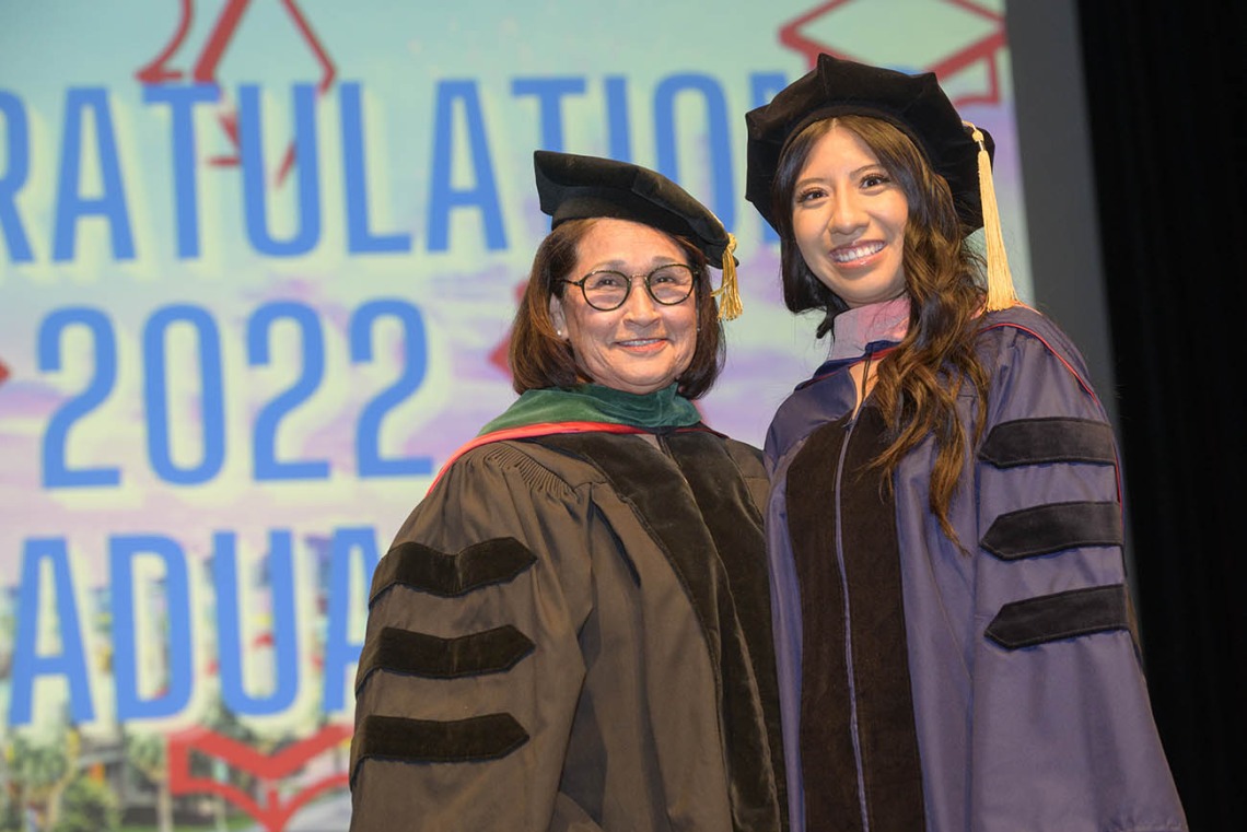 (From left) Cecilia Rosales, MD, associate dean of Phoenix programs, pauses for a photo with Doctor of Public Health graduate Sheila Soto at the Mel and Enid Zuckerman College of Public Health fall convocation.