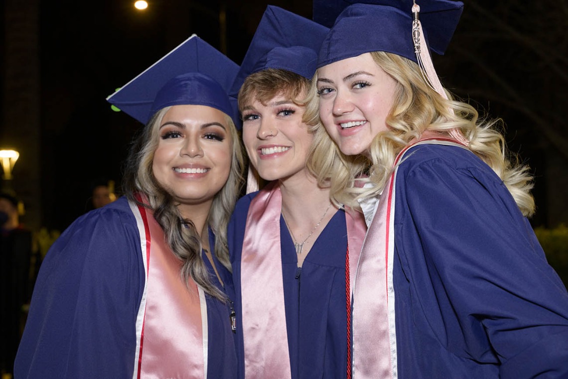 (From left) Valeria Enriquez, Riley Holmes and Ryan Carlo pause for a photo after receiving Bachelor of Science degrees at the Mel and Enid Zuckerman College of Public Health fall convocation.