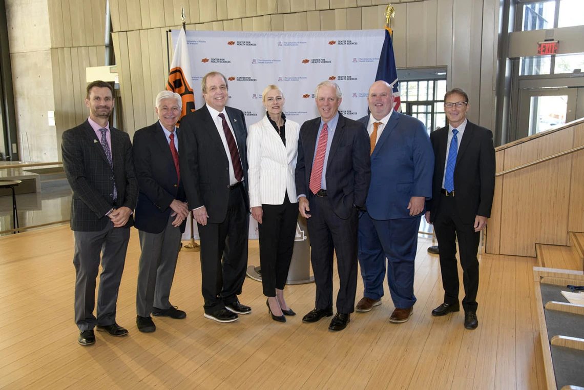 A new partnership between academic medical centers at the University of Arizona and Oklahoma State University involves sharing research assets and knowledge, as well as the preclinical and clinical expertise gleaned from years of research and treatment by scientists and clinicians at both academic medical centers. From left: Todd Vanderah, PhD, Frank Porreca, PhD, Michael D. Dake, MD, Kayse Shrum, DO, Robert C. Robbins, MD, Johnny Stevens, PharmD, Don Kyle, PhD.