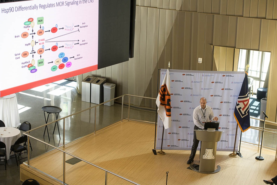 John Streicher, associate professor of pharmacology in the College of Medicine – Tucson, gives a presentation on his research into improving opioid therapy by uncovering the molecular signaling cascades of the opioid receptors.