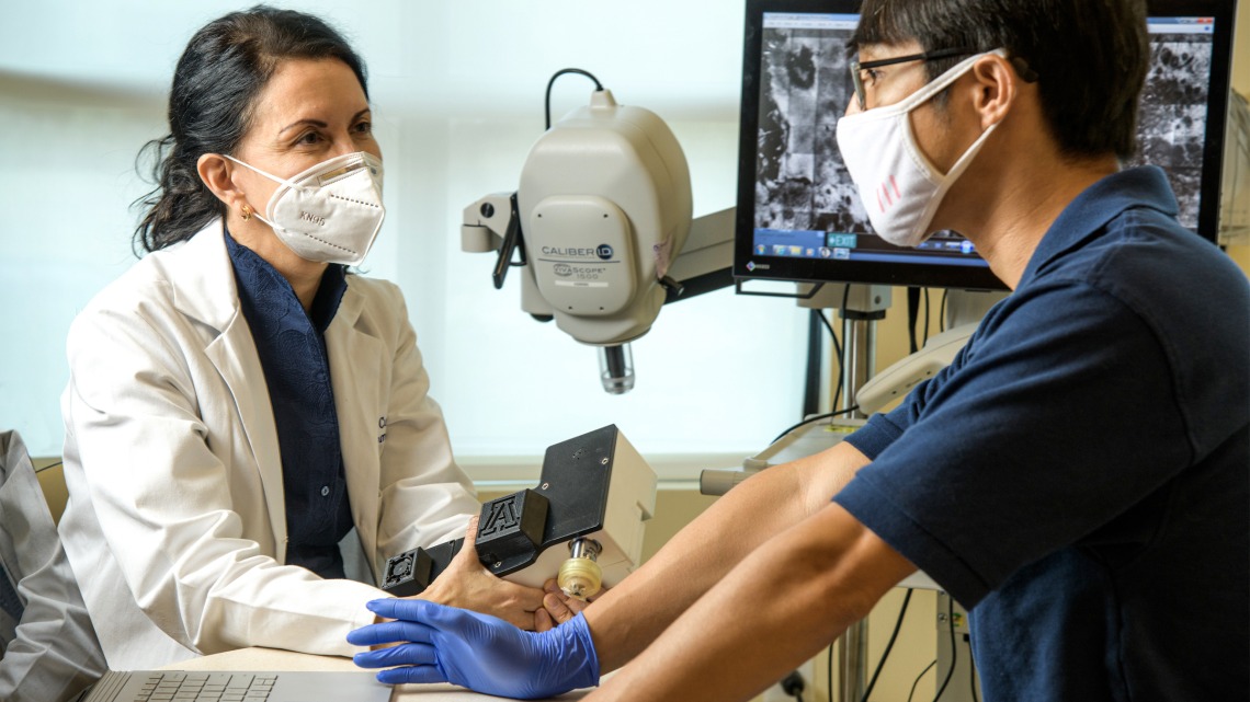 Clara Curiel-Lewandrowski, MD, and Dongkyun Kang, PhD, are collaborating to create a portable, less expensive version of a skin cancer diagnostic microscope.