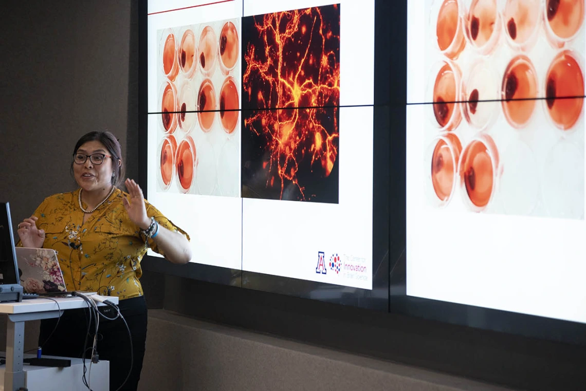 Diné College student Alyssa Joe presents on her ALS-focused research project to an audience of colleagues, professors and mentors from the UArizona Health Sciences Center for Innovation in Brain Science.