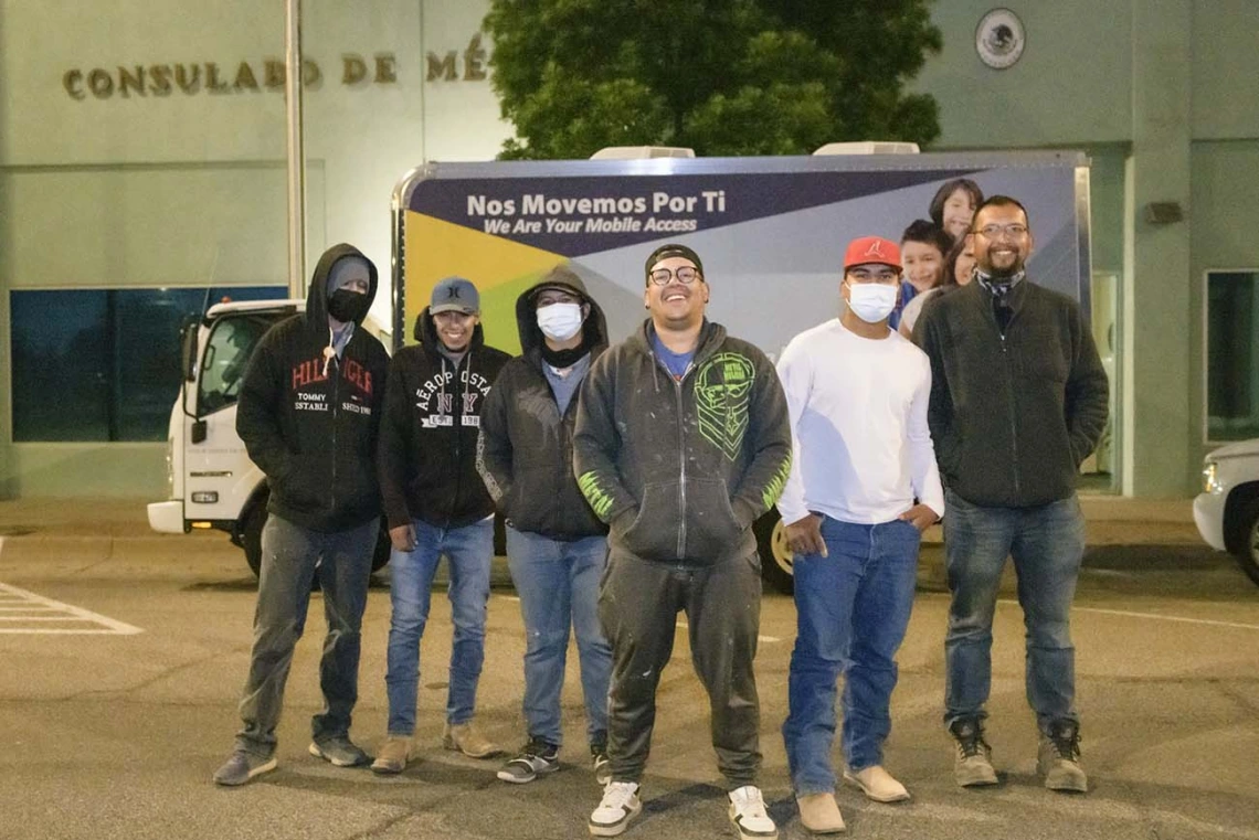 Farmworkers from Agua Prieta, Mexico, gather before dawn at the Mexican Consulate in Douglas for a COVID-19 vaccine clinic hosted by the UArizona Health Sciences, Cochise County Health Department (from left): Oscar Moreno, Mara Rodríguez, Jairo López, Rubén Sosa, Nestor Quiñonez, and Jesús Pérez.