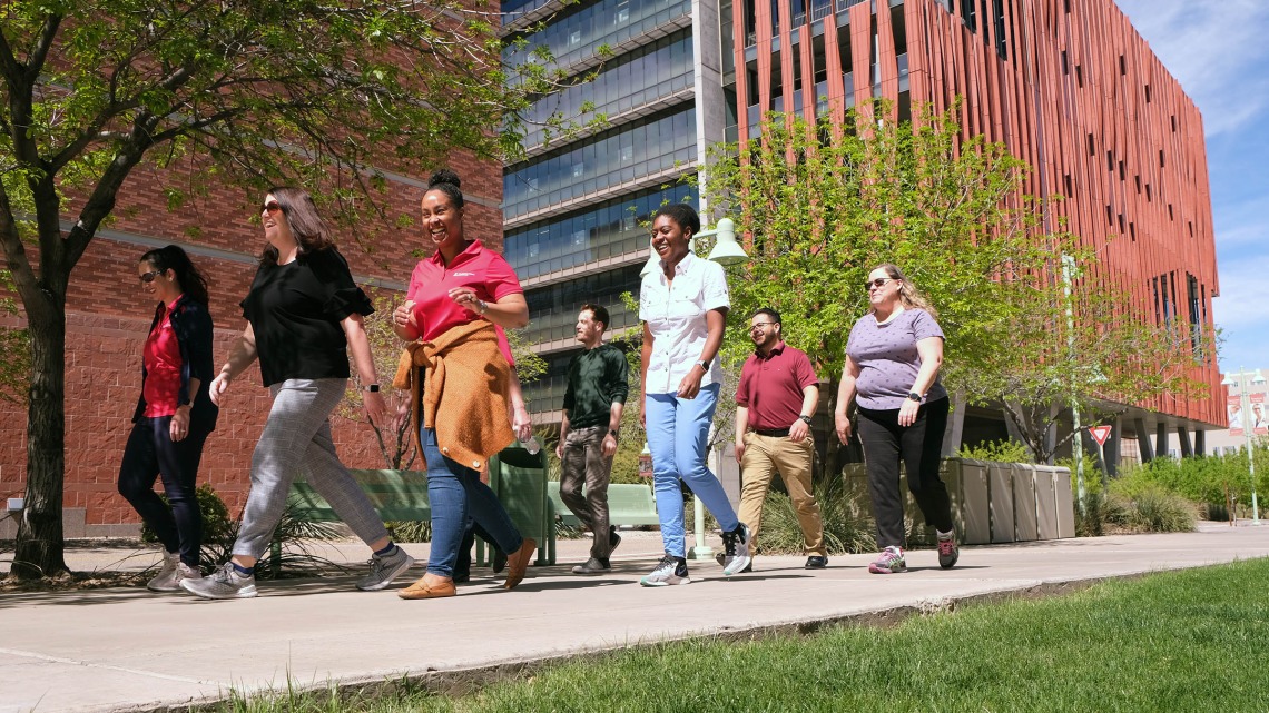 Members of the Health Sciences Research Administration’s Walkie Talkie teams walk regularly during lunch. There are four Walkie Talkie teams with a total of 26 members. 
