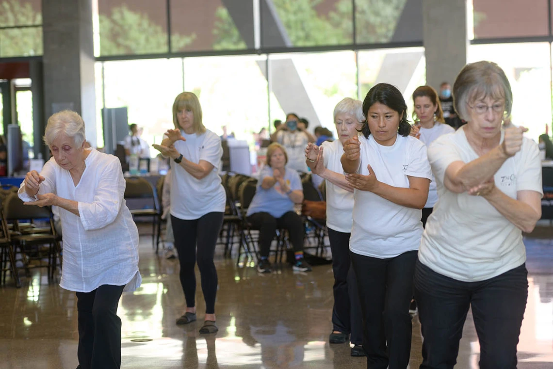 Members of Edna Silva’s Center for Wu Style Tai Chi Chuan demonstrate tai chi at the Feast for Your Brain community event on Sept. 10. 