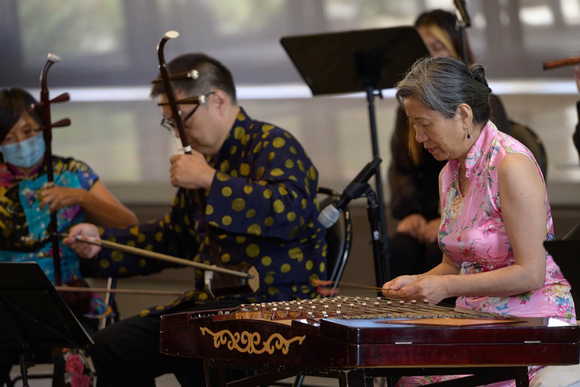 Members of the University of Arizona Asian Music Club’s Purple Bamboo Ensemble perform during the  Feast for Your Brain community event on Sept. 10 in the Forum of the Health Sciences Innovation Building.