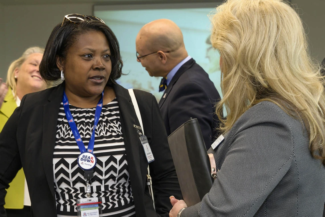 Carla Holloway (left), MEd, the university’s executive director of distance and continuing education, visits with Debbie Robinson, clinical placement coordinator for the College of Nursing, after the ribbon-cutting ceremony in Gilbert, Arizona. 