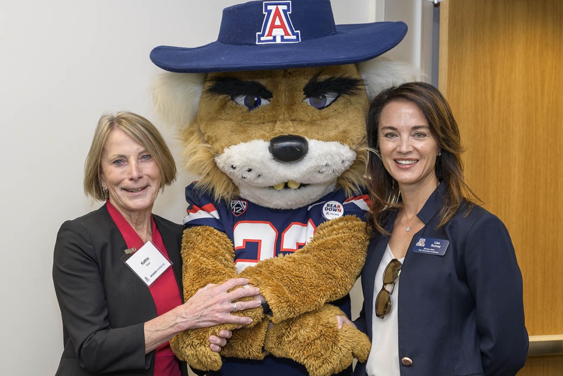 Kathleen Insel, PhD, (left) interim dean of the UArizona College of Nursing, celebrates the opening of the college’s new facility in Gilbert, Arizona, with Wilbur Wildcat and Lisa Rulney, MBA, University of Arizona senior vice president and chief financial officer of business affairs. 