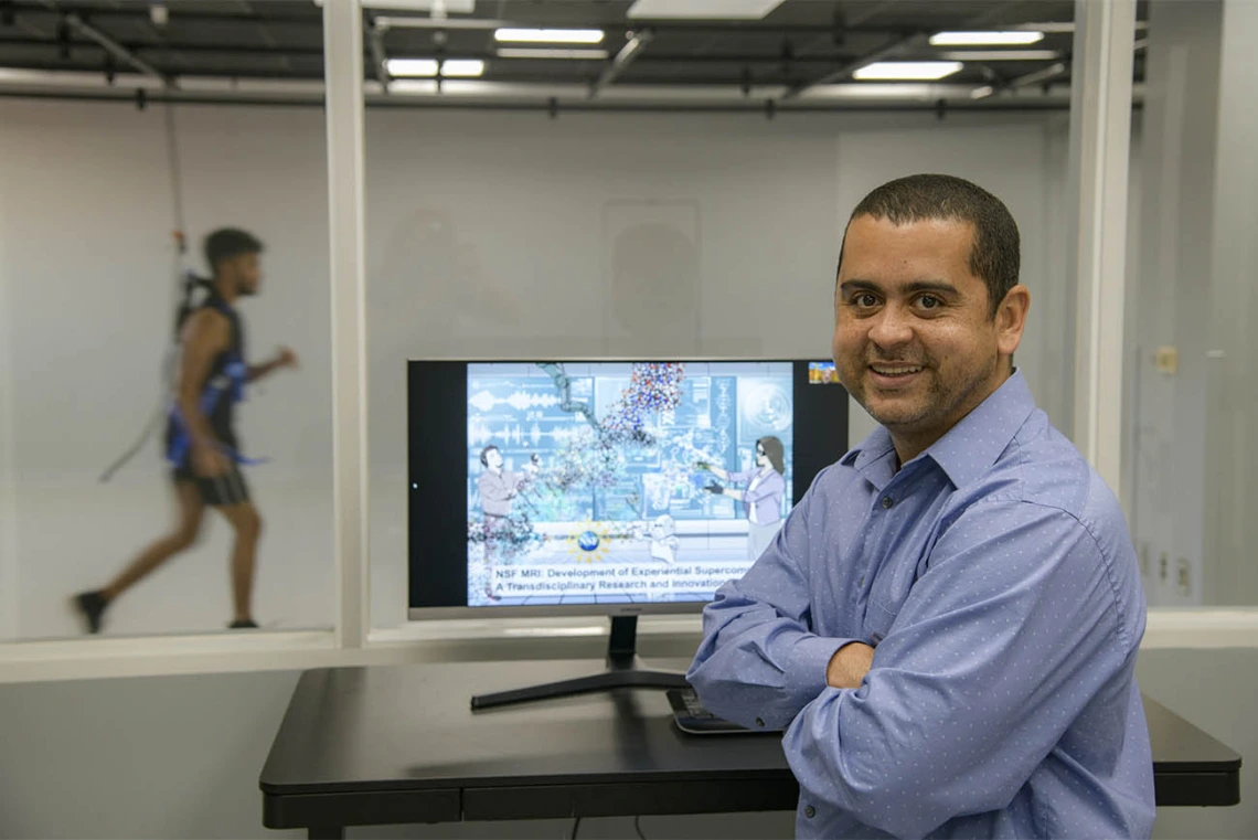 Dr. Almeida shows off one of two Sensor Lab rooms featuring reconfigurable layout options. The rooms can be prepared with the equipment required by the users and reserved for the conduction of research studies. 