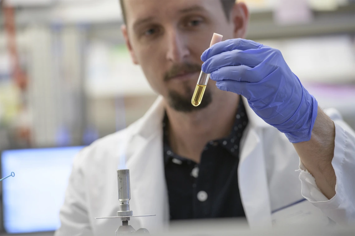 Paweł Łaniewski, PhD, at work as an assistant research scientist in the Herbst-Kralovetz Lab.