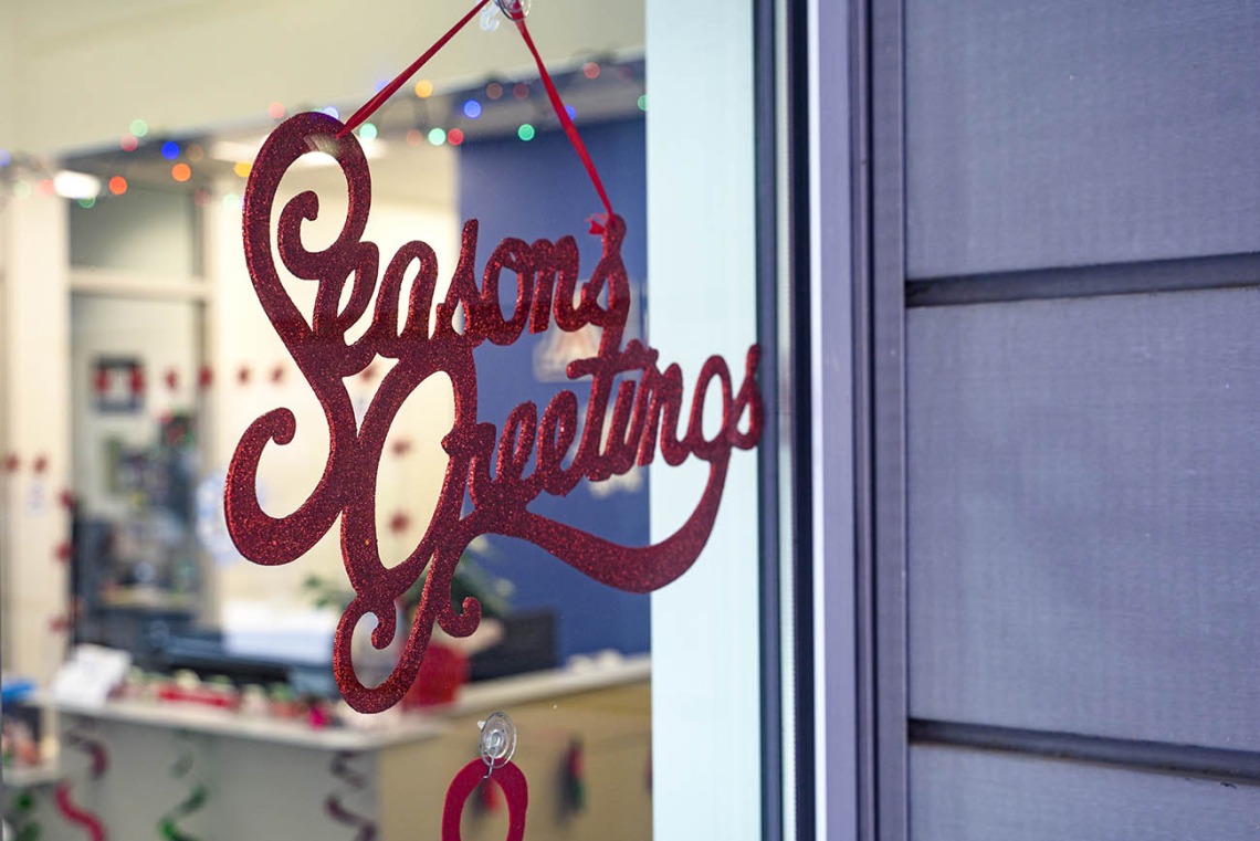 A festive message awaits visitors to the Office of Student Services at the reception area of the R. Ken Coit College of Pharmacy. 