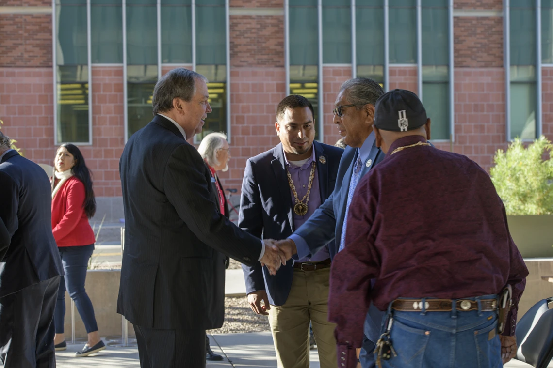 After the blessing, Senior Vice President for the University of Arizona Health Sciences Michael D. Dake, MD, shakes the hand of Ned Norris, chairman of the Tohono O’odham Nation. 