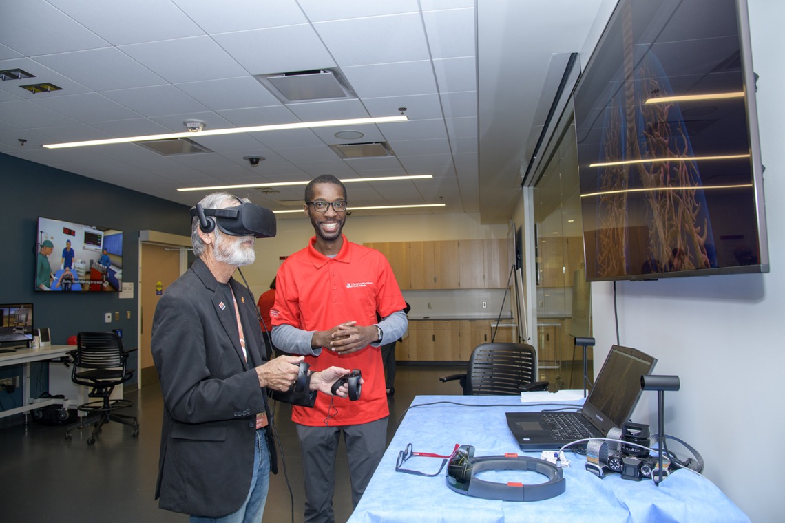 A visitor to the Arizona Simulation Technology and Education Center, or ASTEC, takes a virtual reality tour through the human body.
