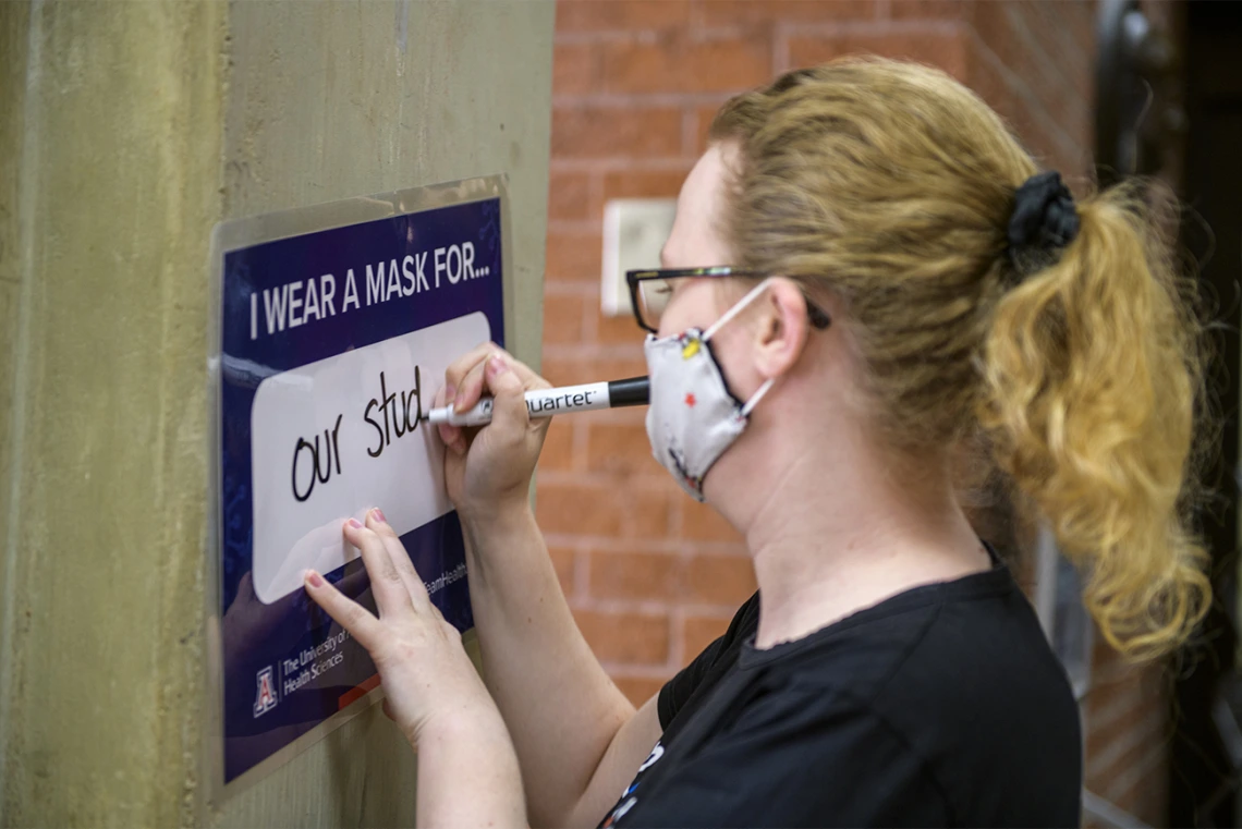 Barbara Moore is an administrative assistant in the Office of Student Affairs at the College of Medicine – Tucson, completes the prompt, “I Wear a Mask For...”