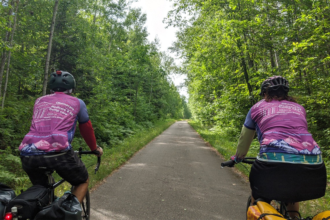 The riders wore jerseys printed with word clouds about health care as a way to prompt conversations with people they met along the bike route.