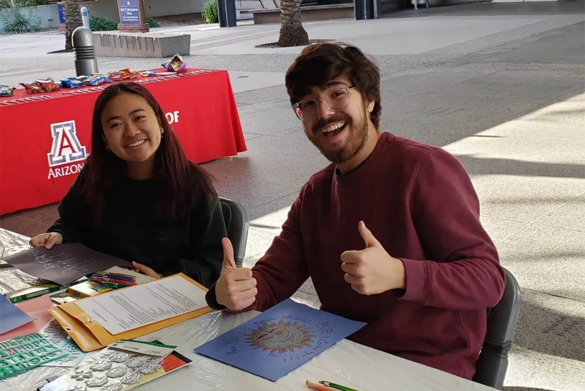 The R. Ken Coit College of Pharmacy Office of Student Services hosted a an end of semester holiday party where Riley Haveman and Sam Ellis, both pharmaceutical science undergraduates, create homemade holiday. 