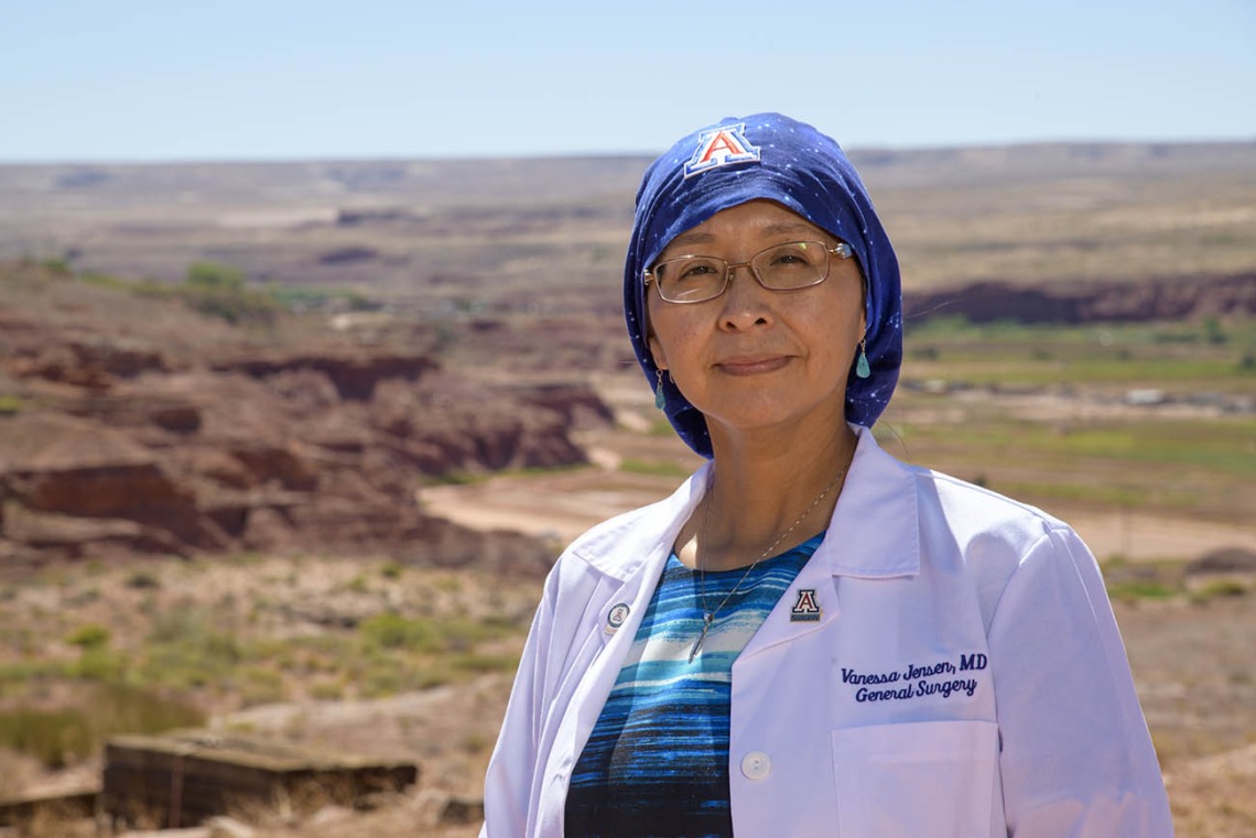 Vanessa Jensen, MD, graduated from the University of Arizona College of Medicine – Tucson in 2003, and completed her general surgery residency in 2009. She stands on her Navajo homestead overlooking the Kerley-Moenkopi Valley, where many of her family members live.