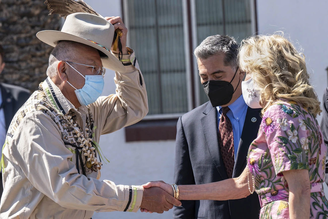 Jerry Carlyle, vice chairman of the San Xavier District, tips his hat as he greets first lady Jill Biden, EdD, at the San Xavier Health Center in the San Xavier District of the Tohono O'odham Nation on March 8, 2022.