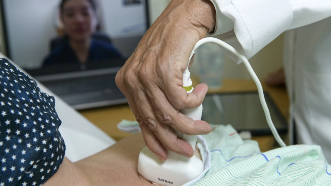 A physician in Bisbee, Arizona, performs an ultrasound while a doctor in Tucson observes remotely via a livestream.