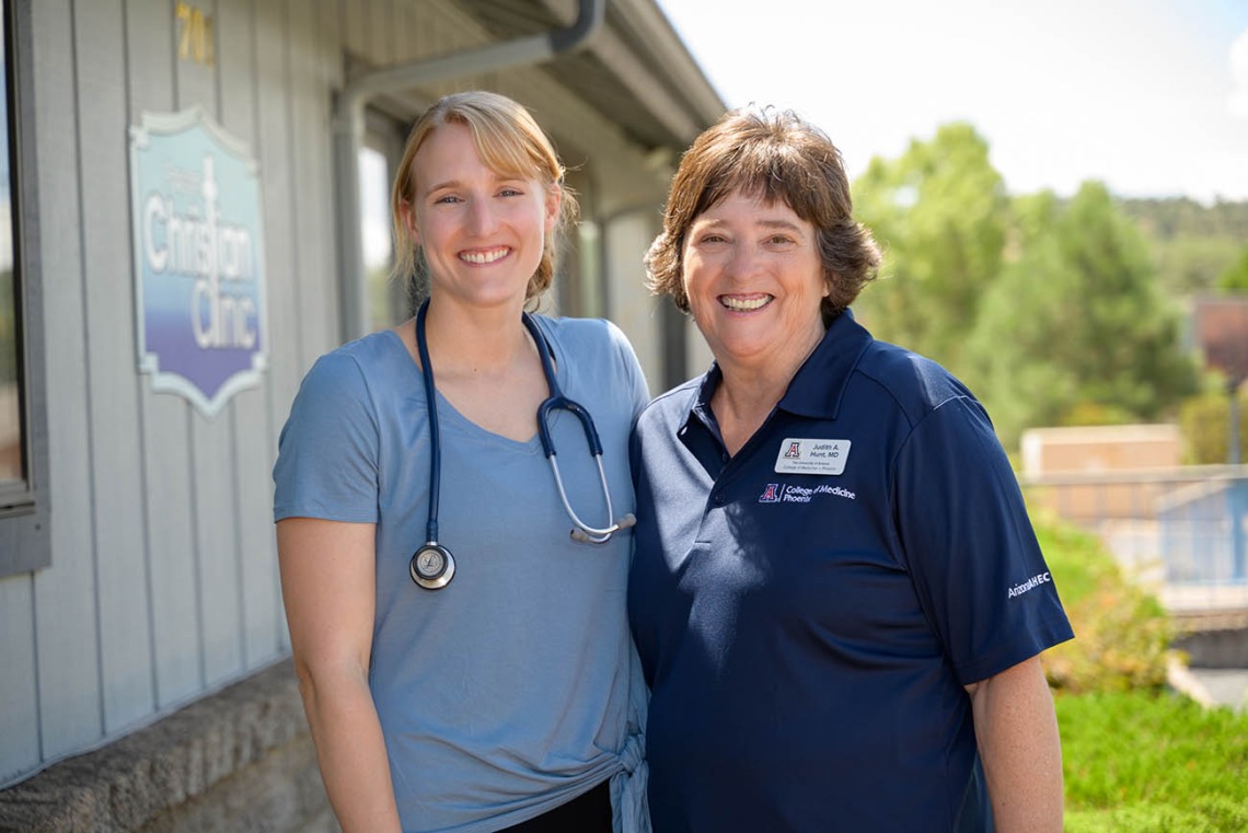Judith Hunt, MD, and resident Lauren Washatka, MD, outside the Payson Christian Clinic, a mercy care clinic Dr. Hunt co-founded. Dr. Washatka was the first student through the rural residency program and is now a resident. 