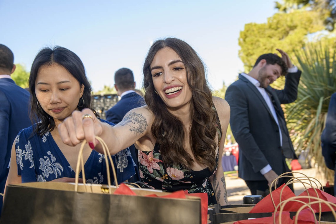 Miranda Tyree reaches for her bag that contains the letter telling her where she matched at the beginning of the UArizona College of Medicine – Tucson 2022 Match Day. 