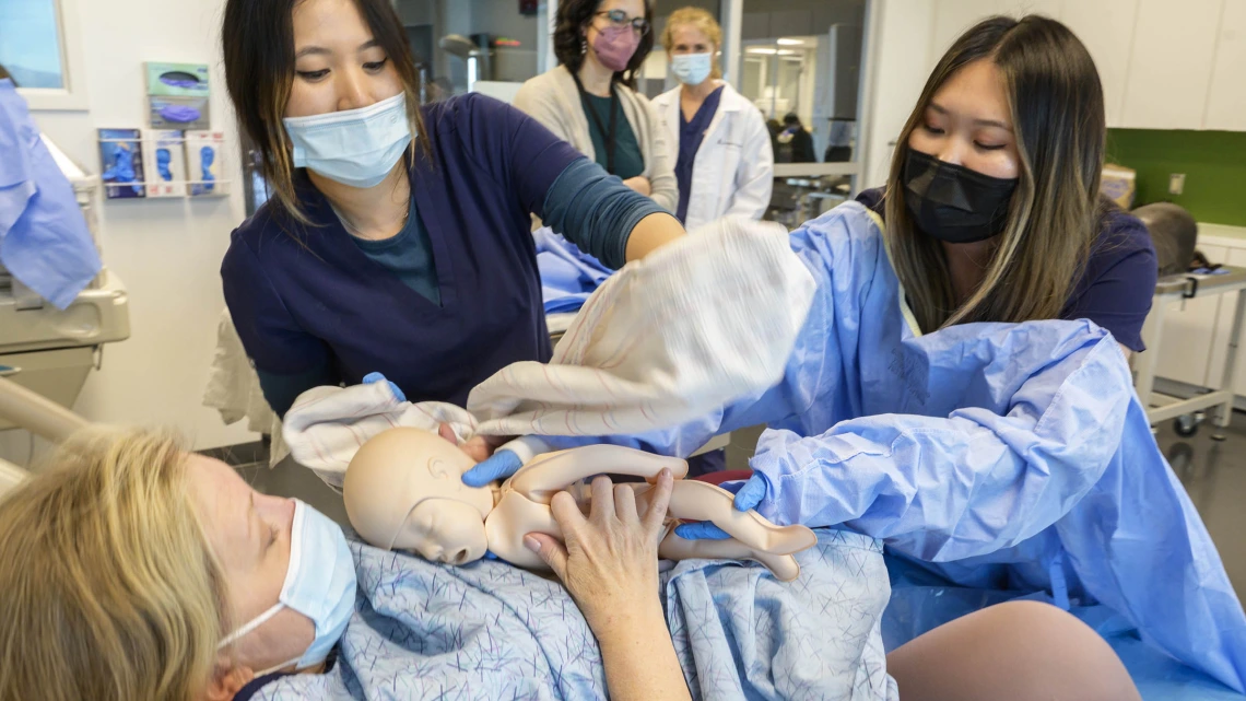 University of Arizona College of Nursing Doctor of Nursing Practice students deliver a manikin baby during a clinical immersion session.