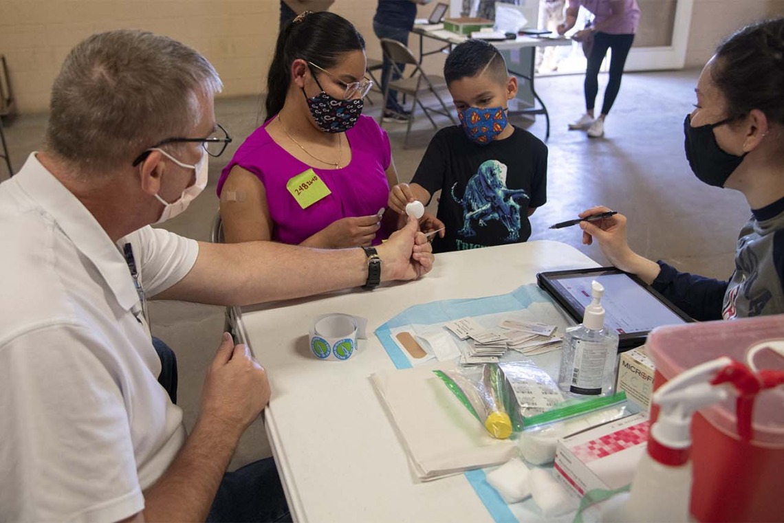 Many people brought their children with them as they visited a vaccine clinic in Aguila, Arizona, last month. Now, those children are eligible to receive the vaccine themselves.