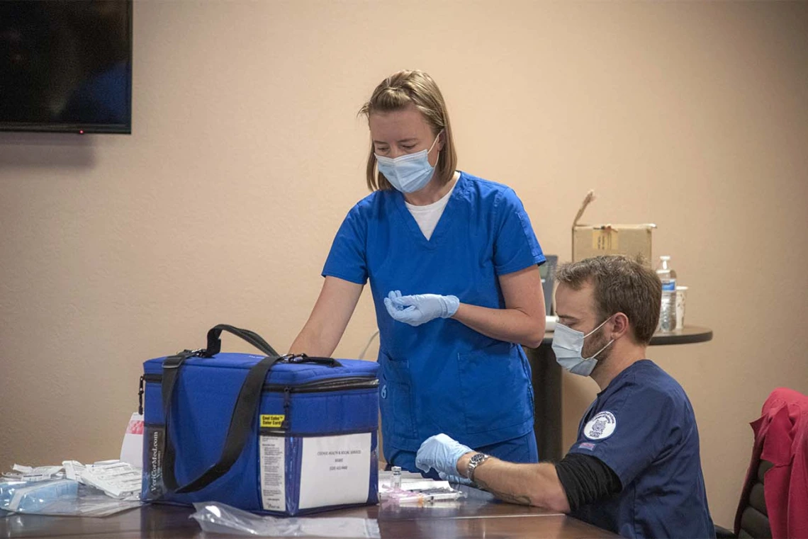 College of Nursing vaccinators prepare vaccines for a COVID-19 clinic hosted April 23 by UArizona Health Sciences and Cochise County Health Department at the Mexican Consulate in Douglas, Arizona.