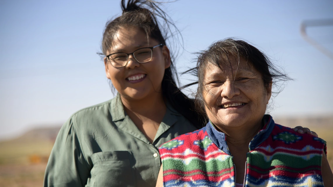 Tiffani Begay and Ida Begay receive donations on the Navajo Nation in early June from the University of Arizona Cancer Center food and supply drive.