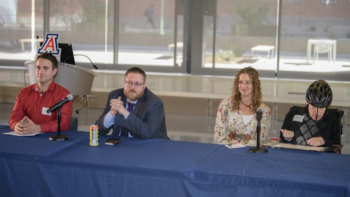 Panelists, from left: Curby Sickmon, Matthew Randle, and interpreter Kelly Hurlbut with Matthew Wangeman.