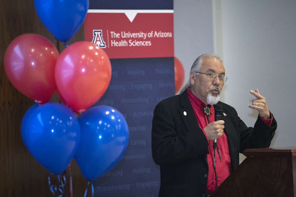 Dr. Carlos Gonzales speaks to attendees during the Tucson Primary Care Physician scholarship reception. 