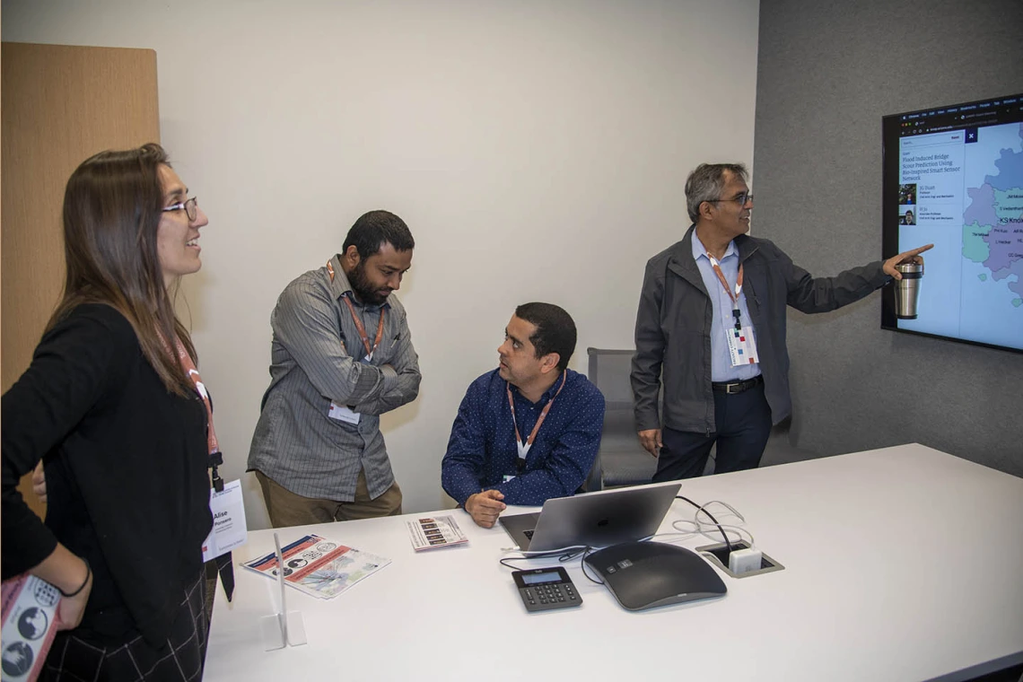 Attendees check out the new space during the grand opening of the Faculty Commons + Advisory, a gathering place where faculty can connect with one another and with experts from various areas of campus to receive advice, direction, and inspiration for research and innovation.