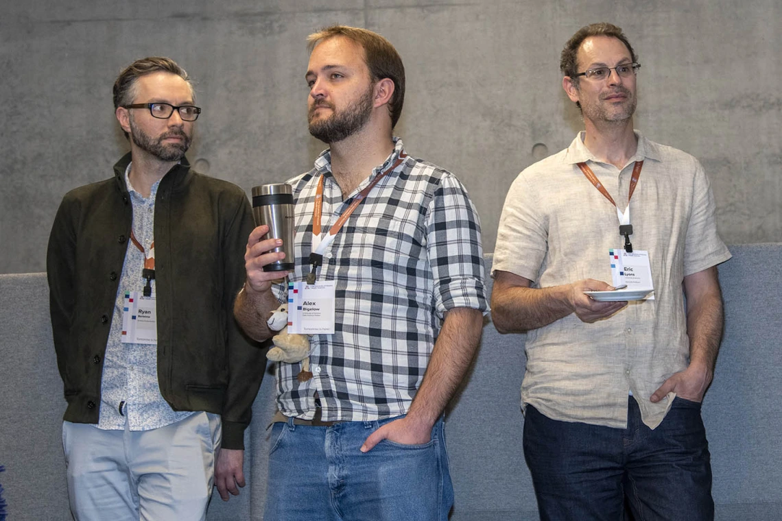 Ryan Bartelme, Alex Bigelow, Eric Lyons listen to University of Arizona Senior Vice President of Health Sciences Michael D. Dake, MD.