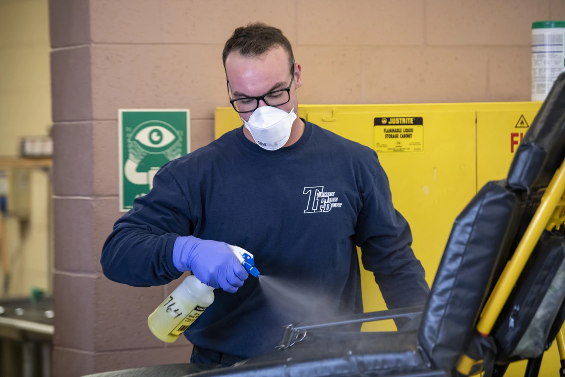 Tucson Fire Department’s Taylor Parrish sanitizes equipment after transporting a possible COVID-19 patient to the hospital. The University of Arizona Mel and Enid Zuckerman College of Public Health worked in conjunction with Tucson Fire Department and the Western Regional Public Health Training Center to create a training video about protocols for first responders to avoid infection during an outbreak.