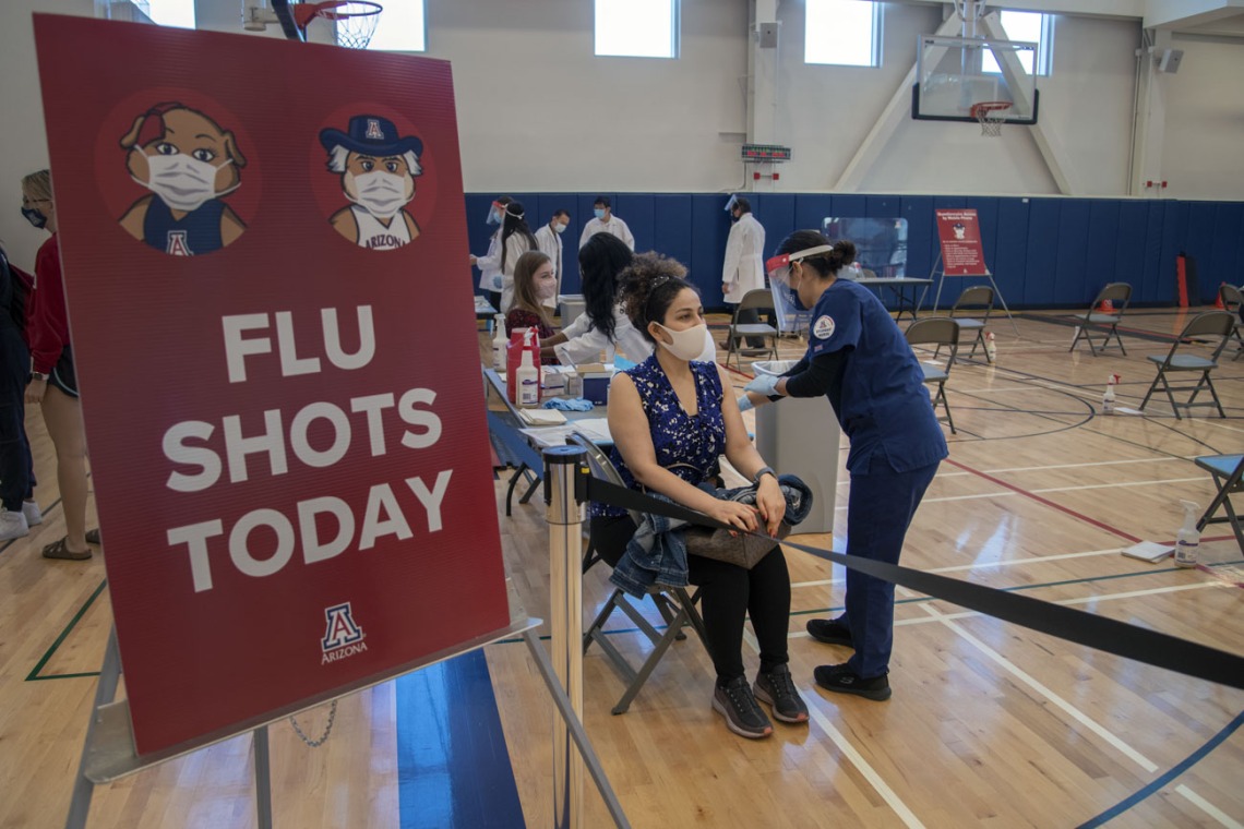 University of Arizona College of Law student Maryam Azimi receives a flu shot from College of Nursing student Abbygail Chavez-Gonzalez inside UArizona Recreation and Wellness Center at Honors Village.