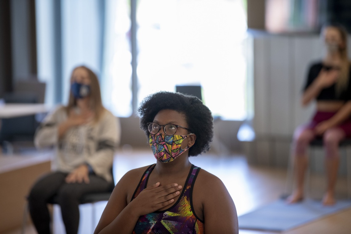 N’Dea Walker practices a breathing technique designed to bring awareness to breath and body and promote mindfulness.