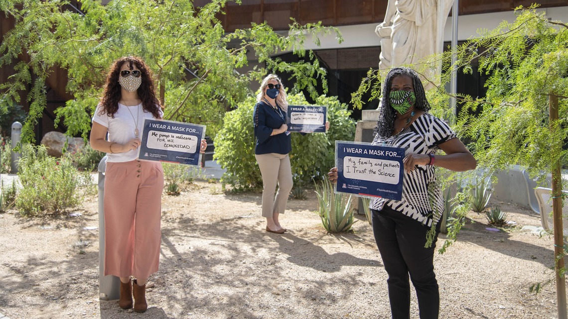 A showing of support for public health protocols from the College of Medicine – Tucson’s Office of Diversity, Equity and Inclusion. From left: Michelle Ortiz, PhD, Rachelle Powell, Victoria Murrain, DO.
